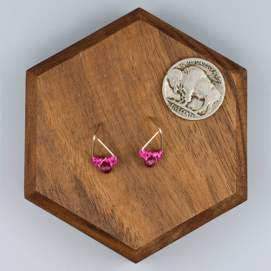 handmade gold filled triangle stud earrings with pink tourmaline beads with a nickel for size comparison