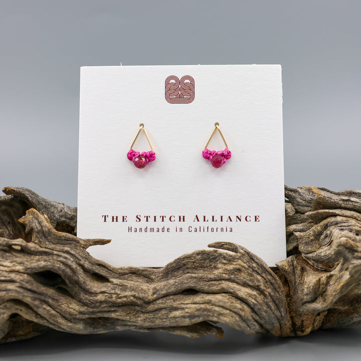 handmade gold filled triangle stud earrings with pink tourmaline beads on a white cartd