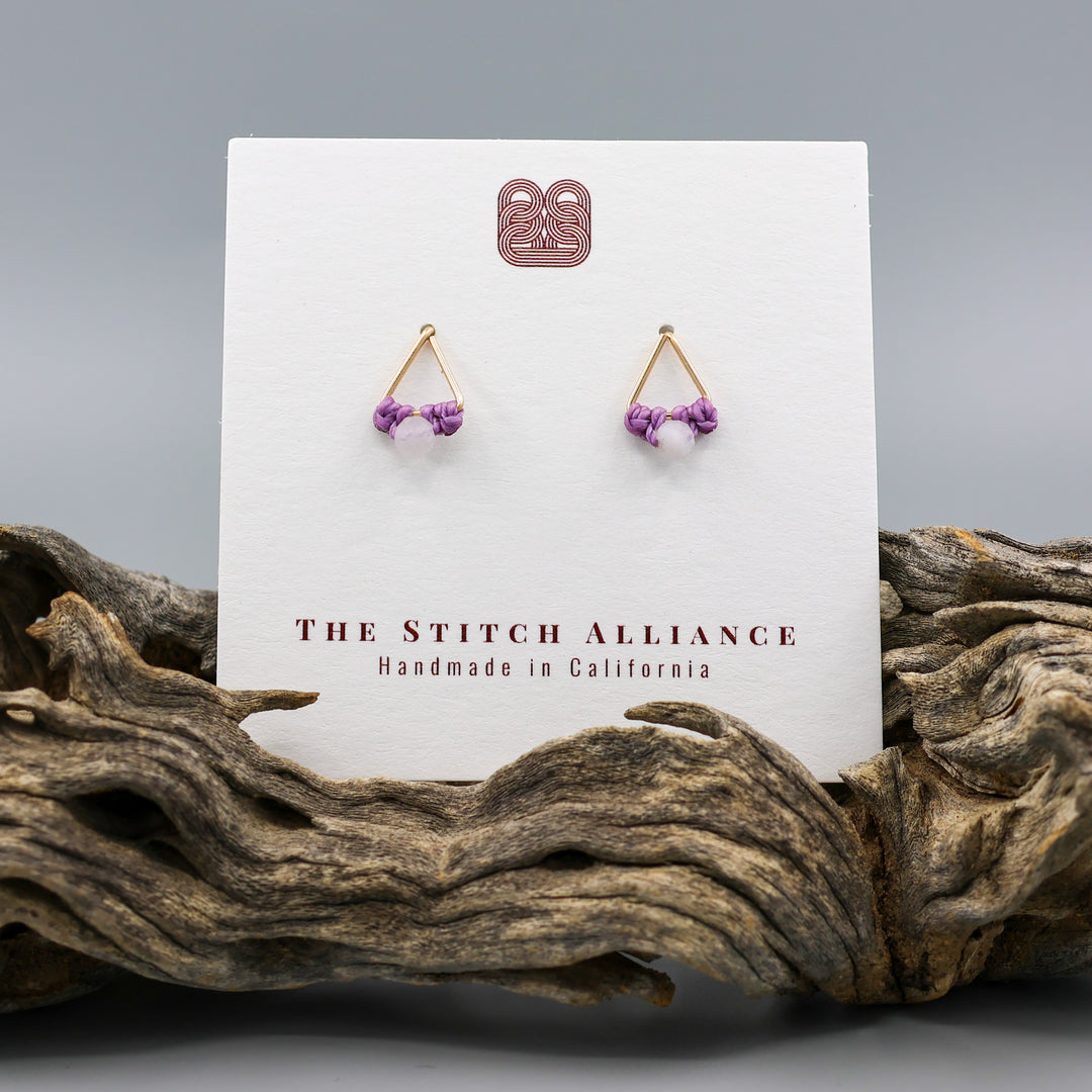 handmade triangle shaped earrings in gold fill with a rainbow moonstone bead on a white card
