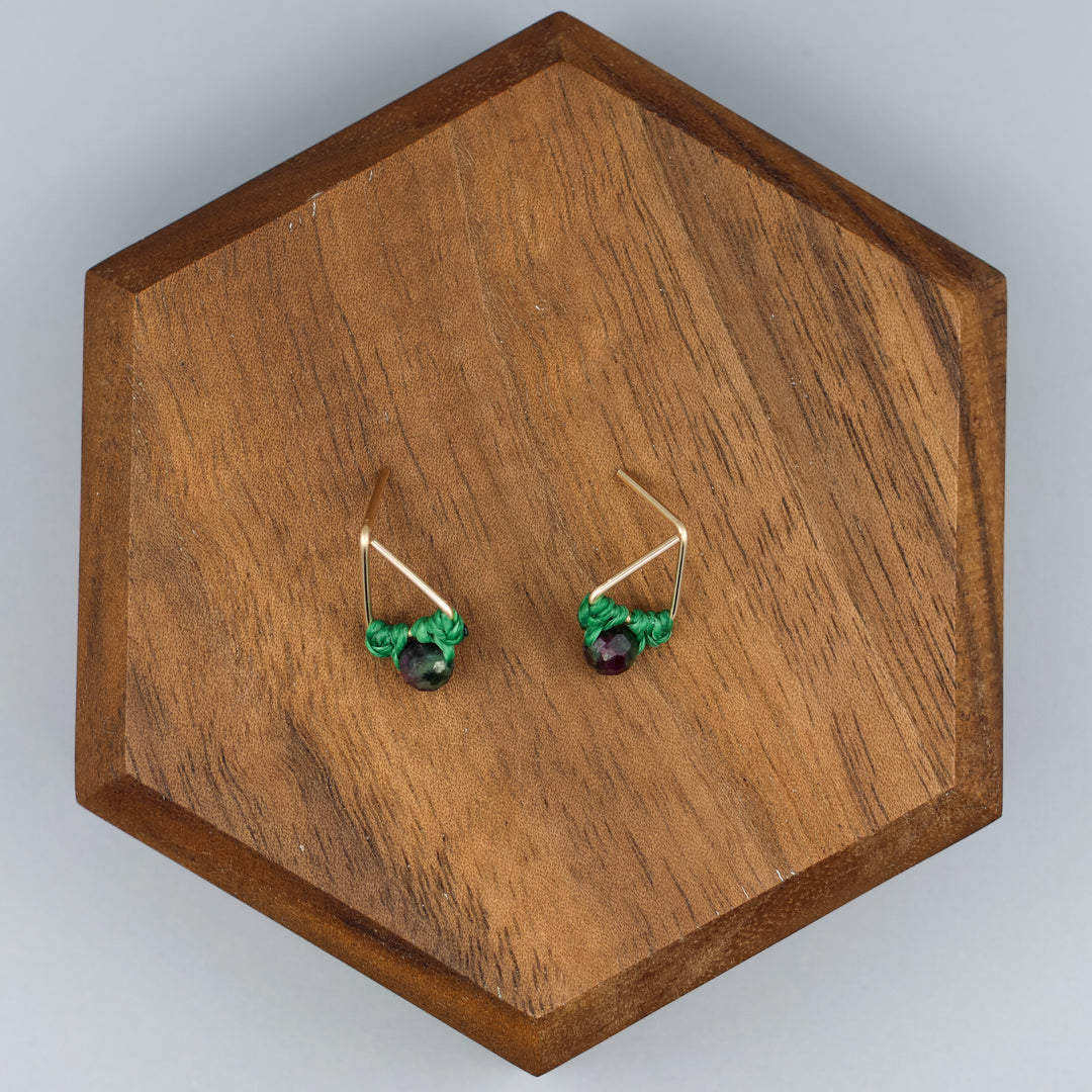 handmade gold filled triangle stud earrings with ruby zoisite beads overhead view