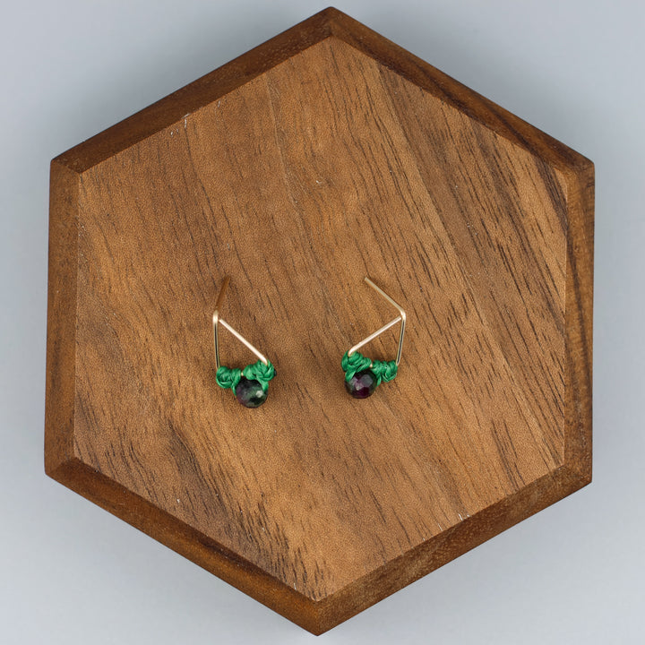 handmade gold filled triangle stud earrings with ruby zoisite beads overhead view
