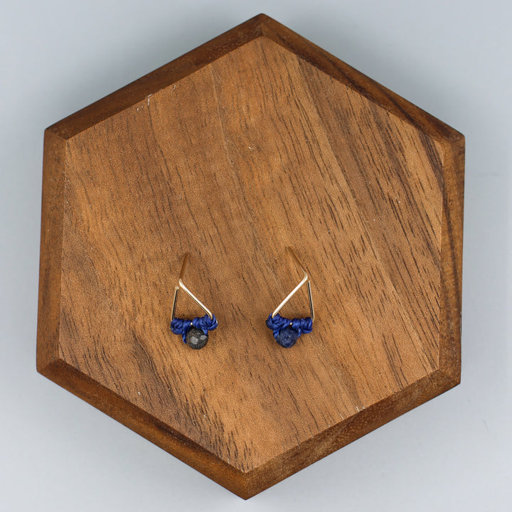 handmade gold filled triangle stud earrings with sapphire beads  overhead view