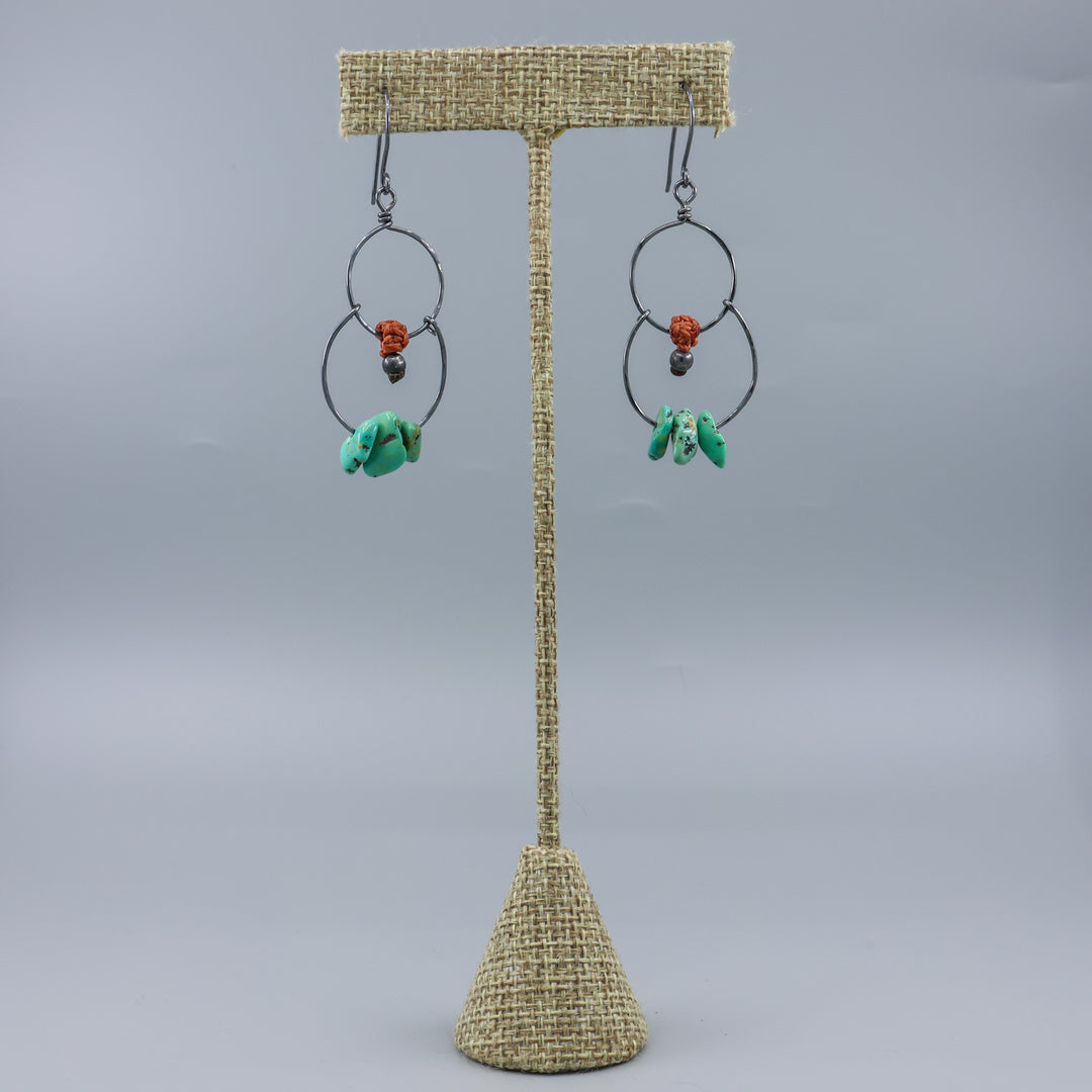 handmade double hoop earrings with turquoise beads and oxidized sterling silver on a linen hanger