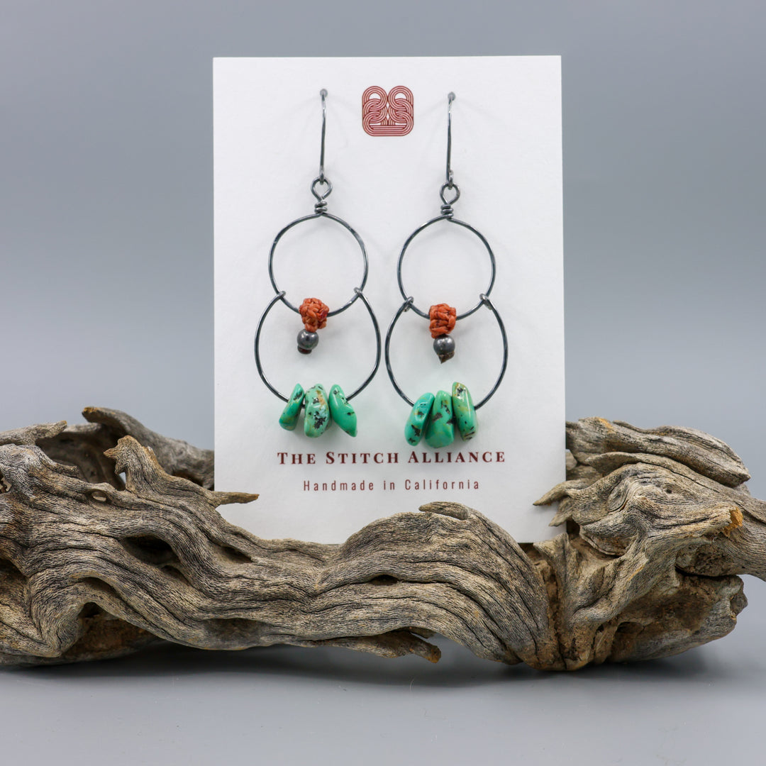 handmade double hoop earrings with turquoise beads and oxidized sterling silver on a white card