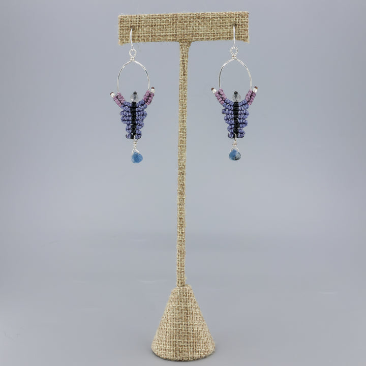 handmade macrame earrings, sterling silver hoops with kyanite and labradorite beads shown on a linen hanger