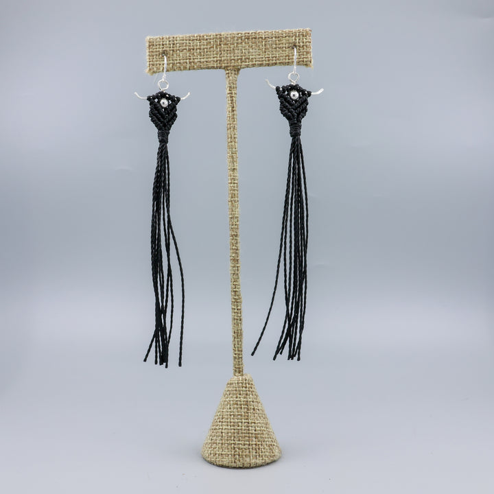 Long, handmade macrame statement earrings in black with sterling silver on a linen hanger