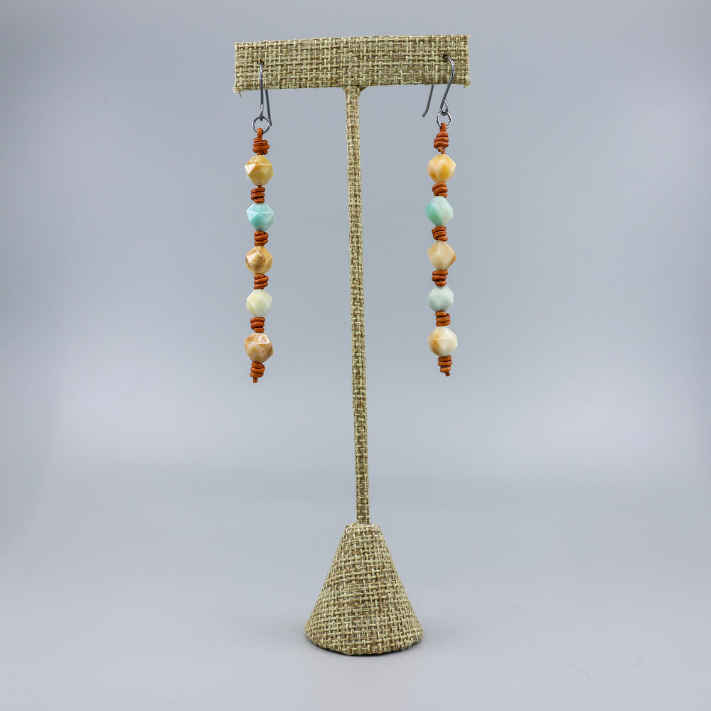 handmade amazonite and leather barrell knot earrings with handmade oxidized sterling silver ear wires on a linen hanger