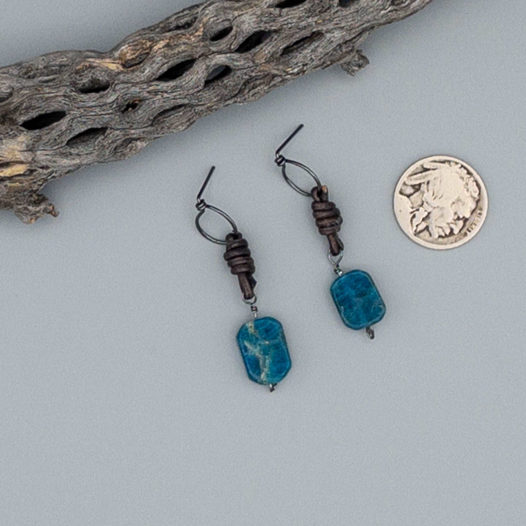 apatite, leather, and sterling silver drop earrings with a nickel for size comparison