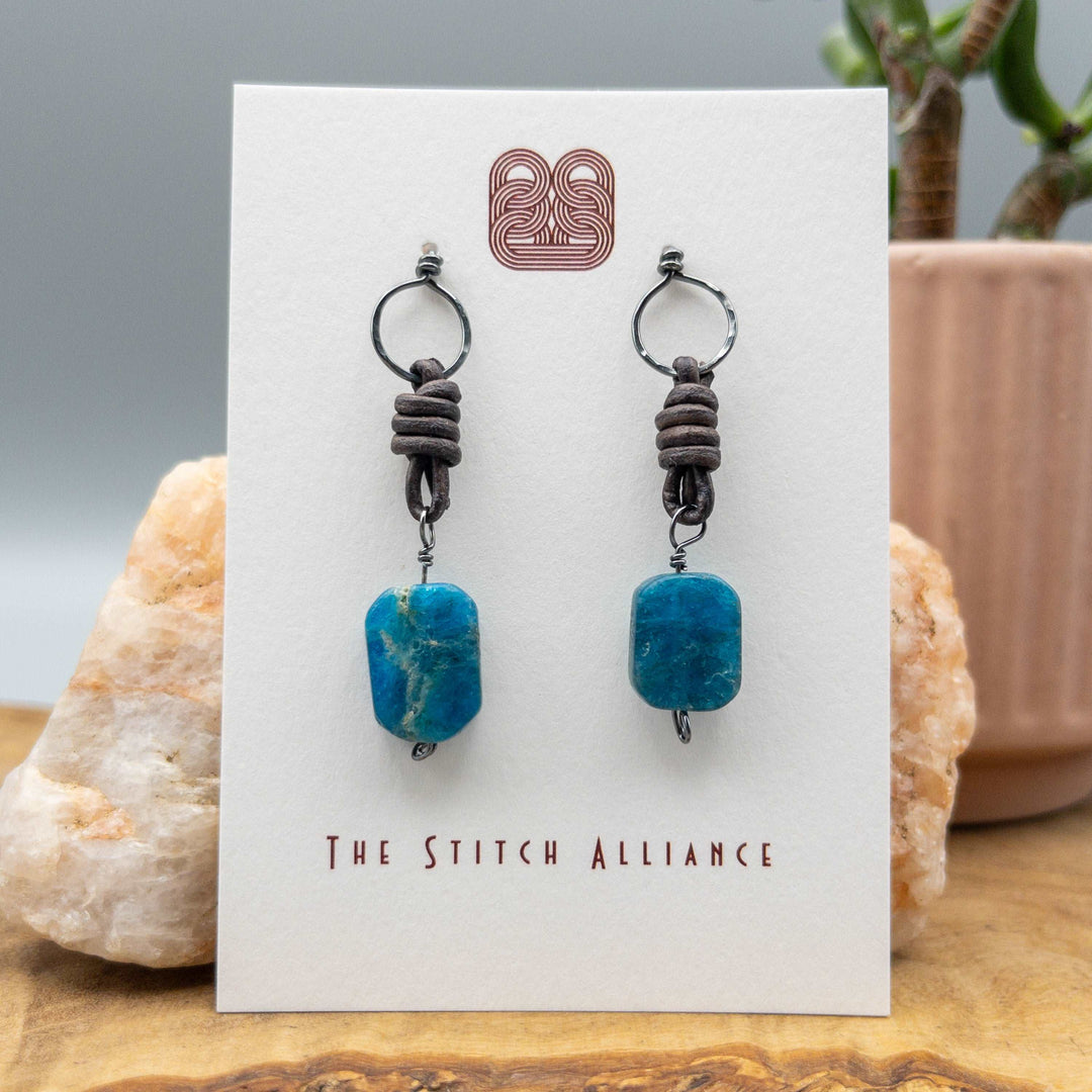 apatite, leather, and sterling silver drop earrings on a white card