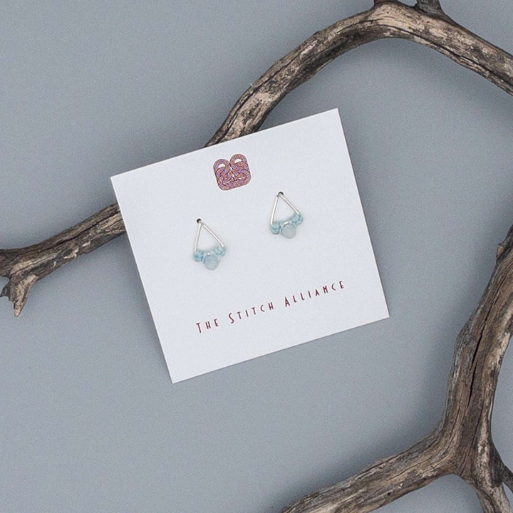 Triangle shaped earrings in sterling silver with aquamarine beads
