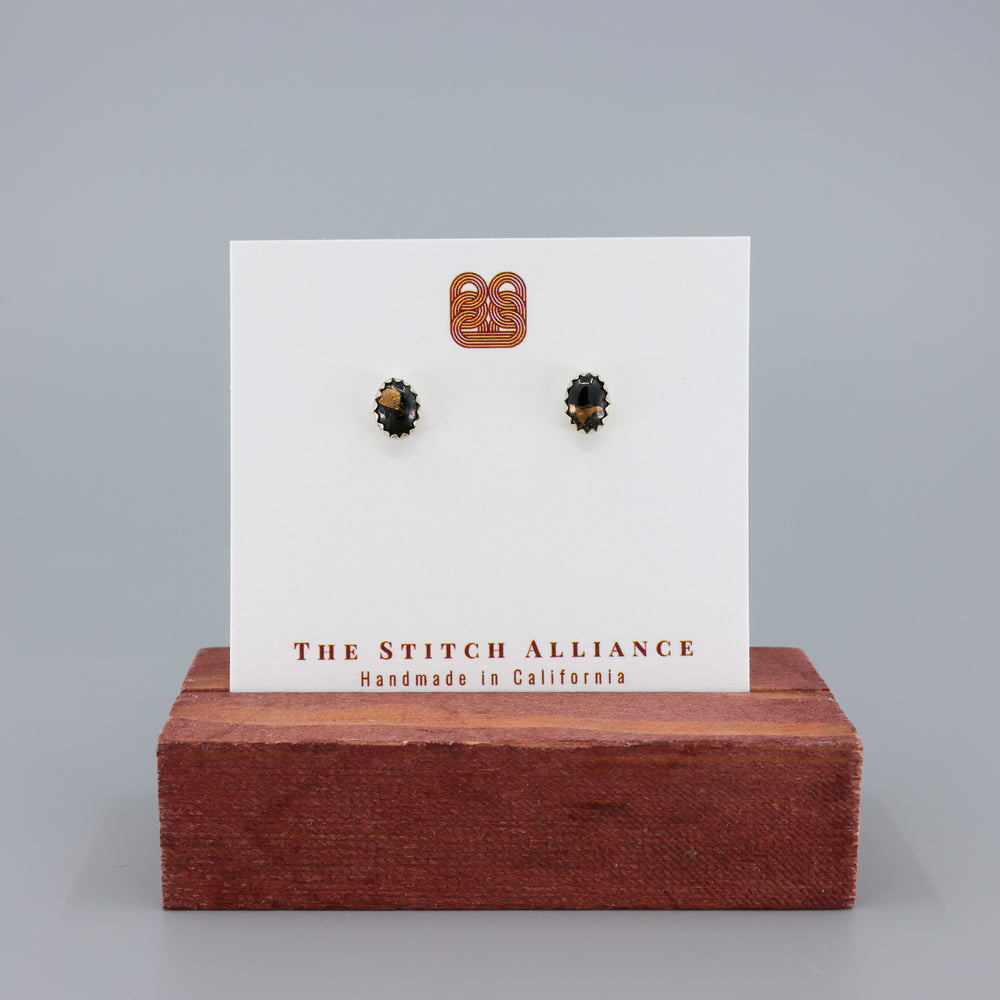 handmade black copper obsidian stud earrings on a white card