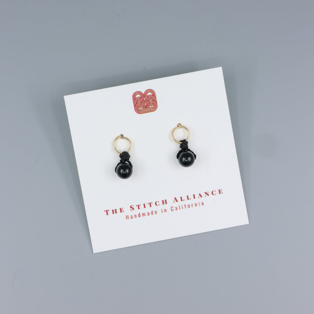 black spinel mini dangle earrings gold fill handmade on a white card