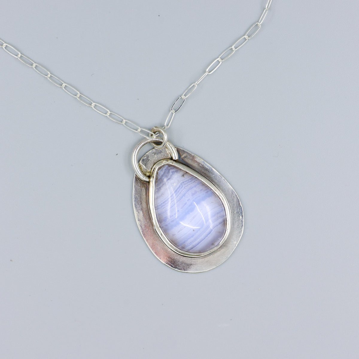 blue lace agate sterling silver one of a kind necklace overhead view