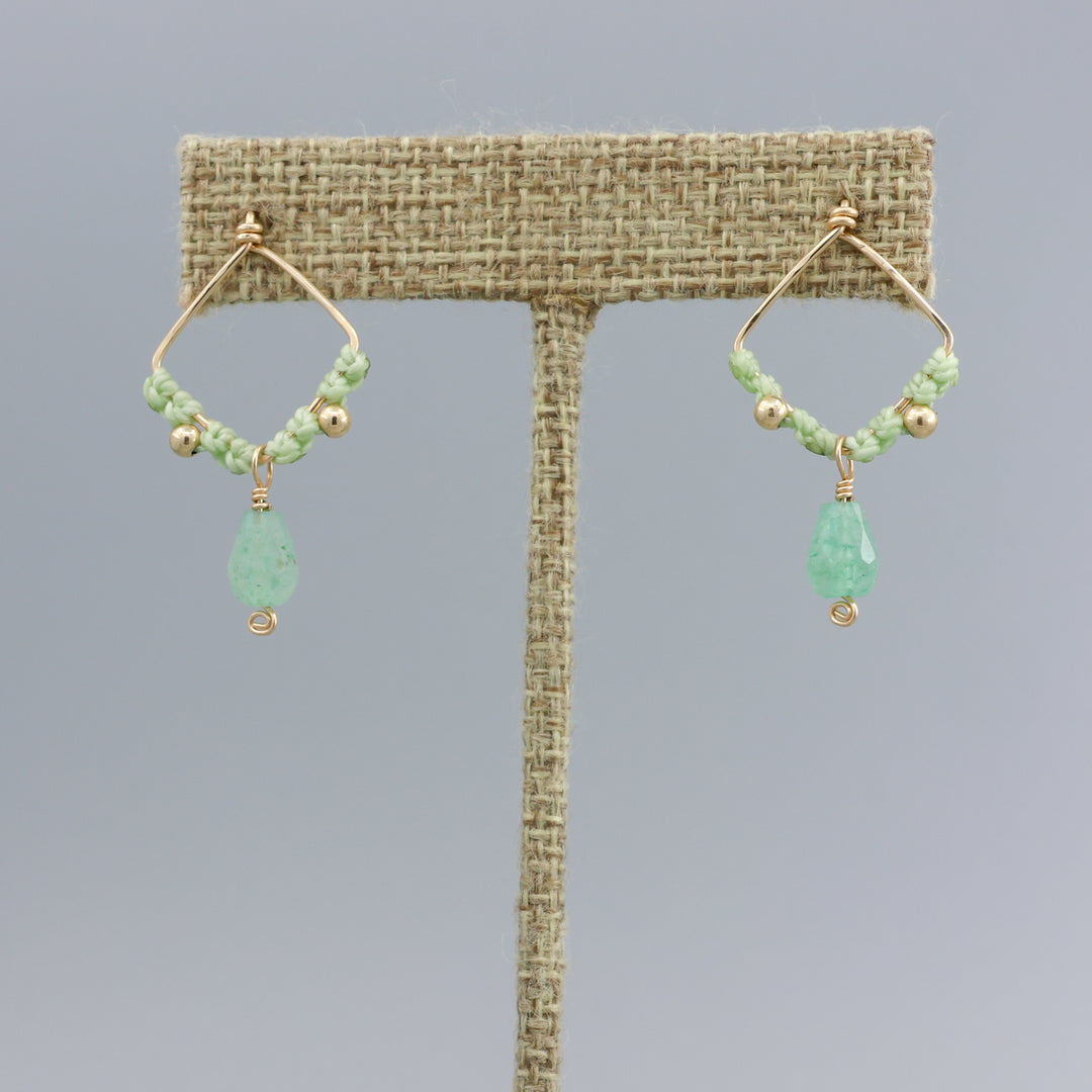 green chalcedony handmade macrame drop earrings on a linen display hanger