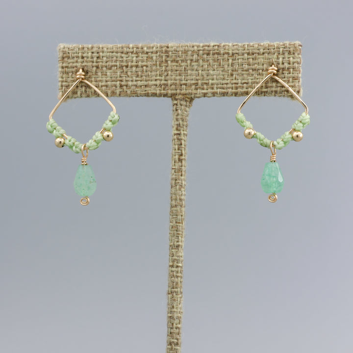 green chalcedony handmade macrame drop earrings on a linen display hanger
