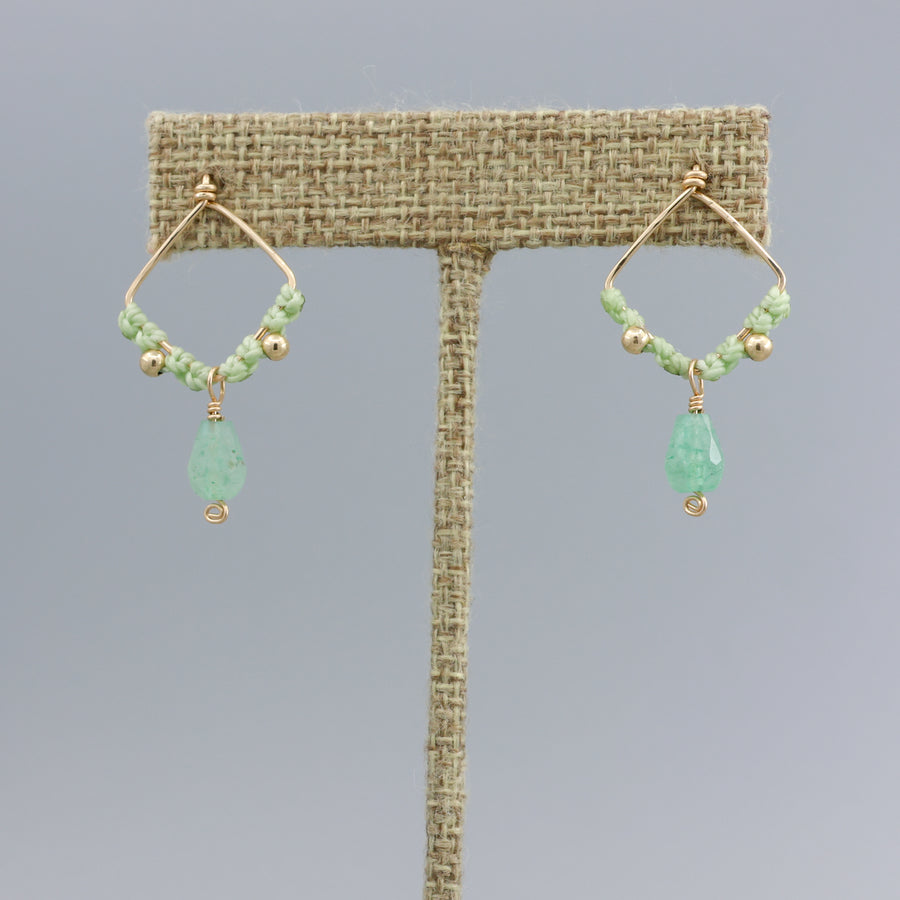 green chalcedony handmade macrame drop earrings on a linen display hanger