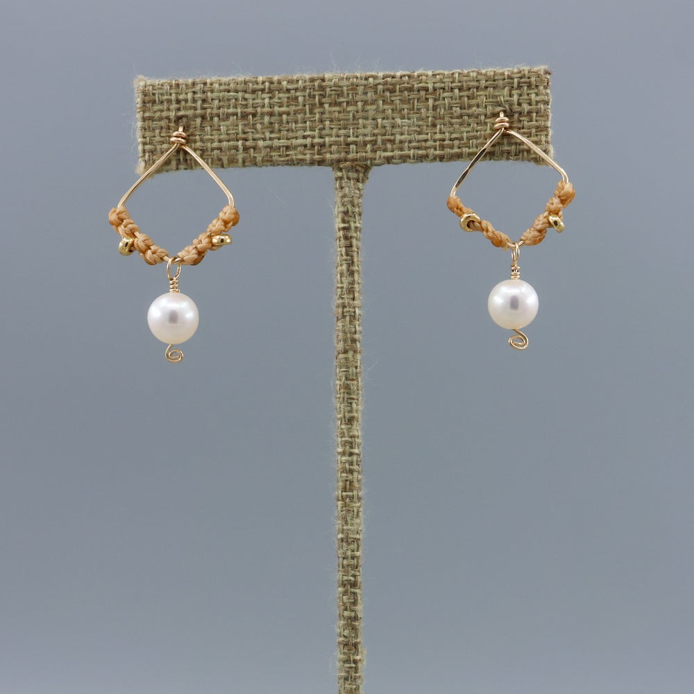 handmade square shaped gold macrame earrings with freshwater pearl beads on a linen hanger