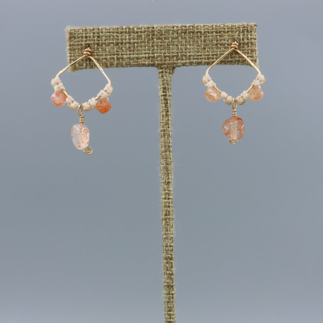 handmade gold fill and sunstone macrame earrings on a linen hanger