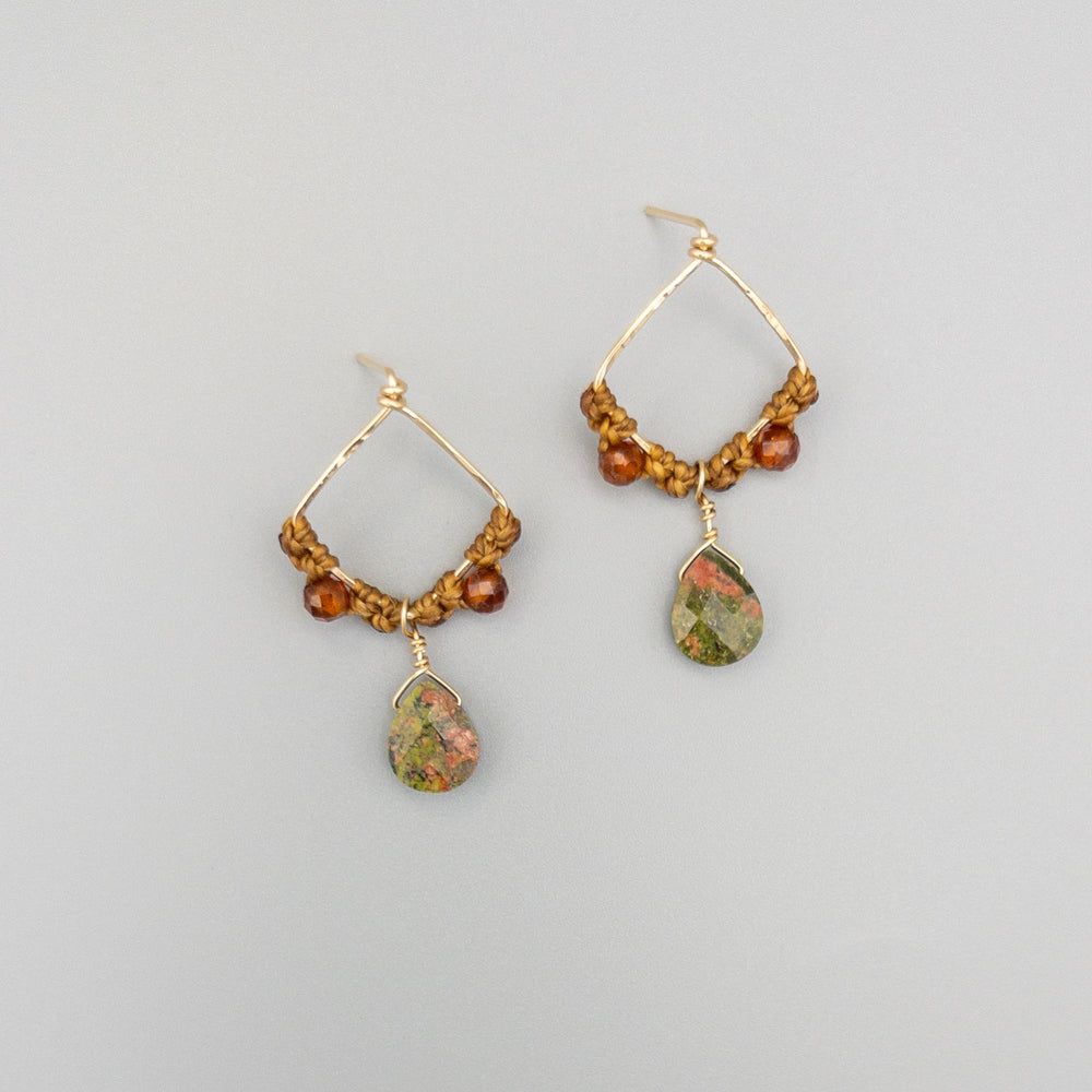 unakite and hessonite squre, gold filled drop earrings on a gray background