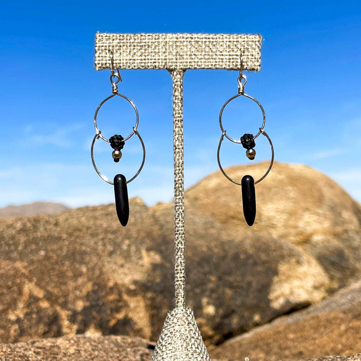 oxidized sterling silver wire double hoop earrings with black howlite beads.