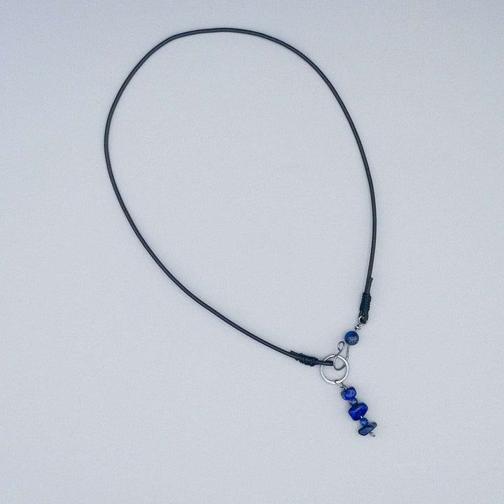 Lapis Lazuli Sterling Silver and Leather choker necklace on a gray background
