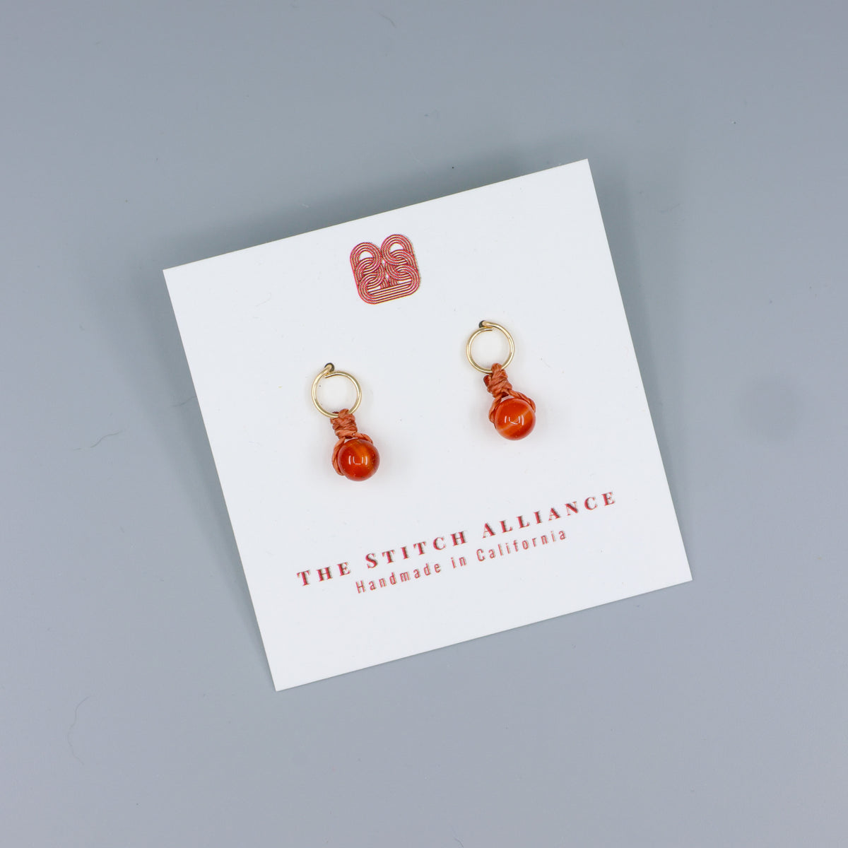 carneleian mini dangle earrings gold fill handmade on a white card