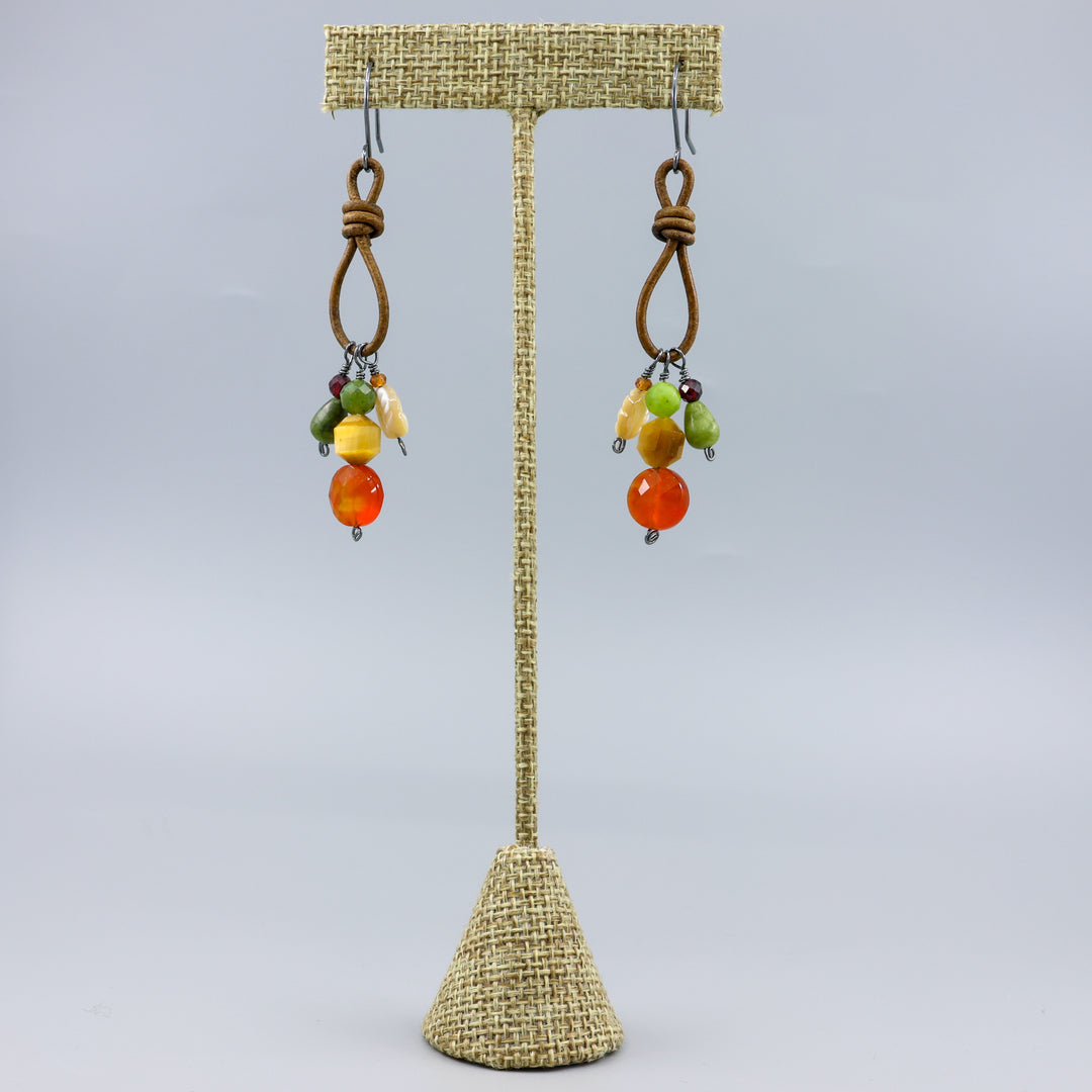 handmade gemstone charm earrings leather and oxidized sterling silver on a linen hanger