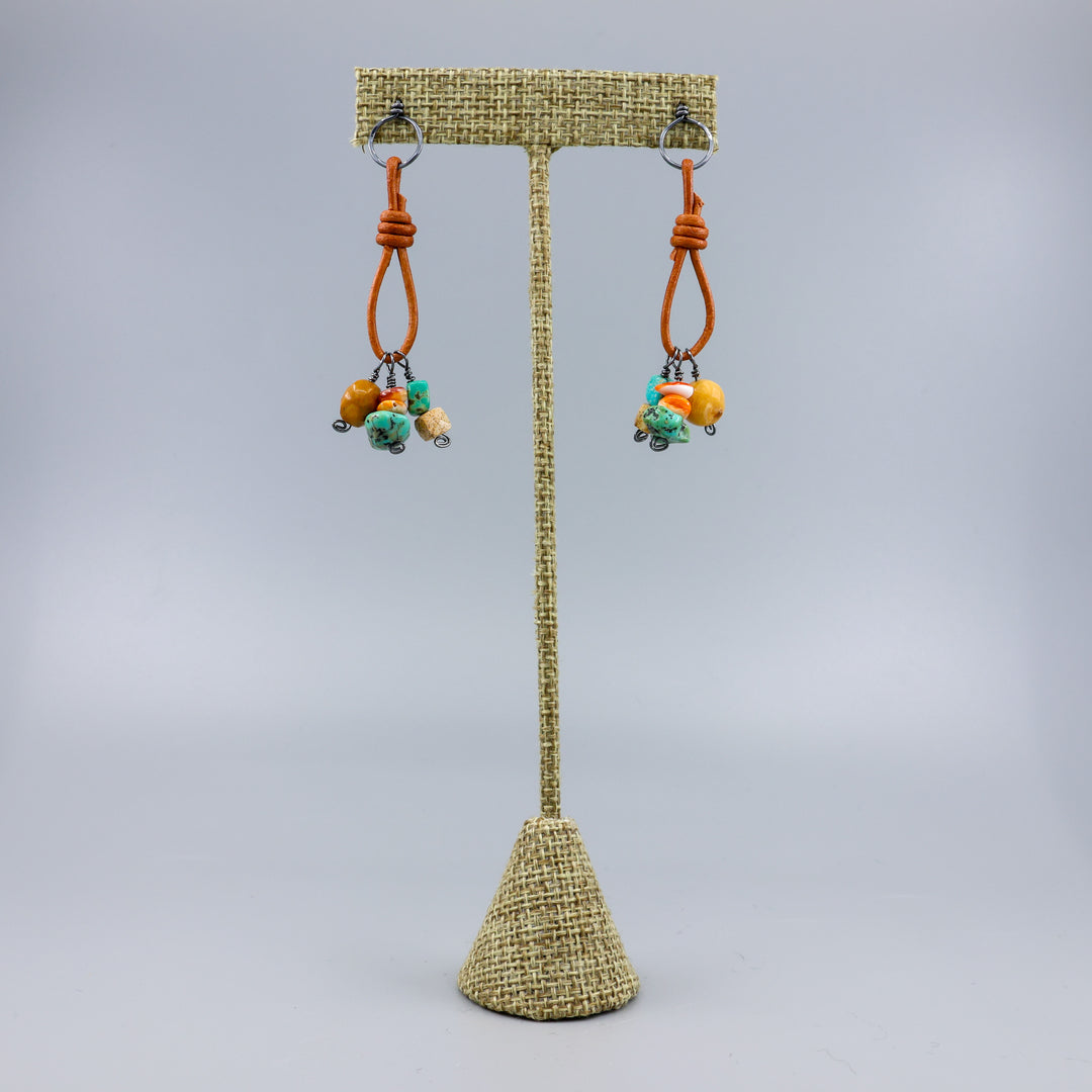 handmade turquoise, jasper, agate, and spiny oyster leather and oxidized sterling silver earrings on a linen hanger