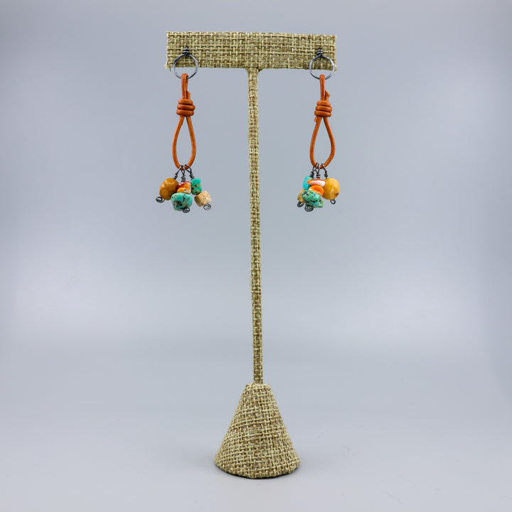 handmade turquoise, jasper, agate, and spiny oyster leather and oxidized sterling silver earrings on a linen hanger