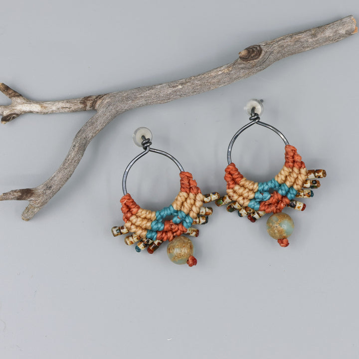 
sterling silver macrame earrings in sedona colors with aqua terra jasper bead lying flat