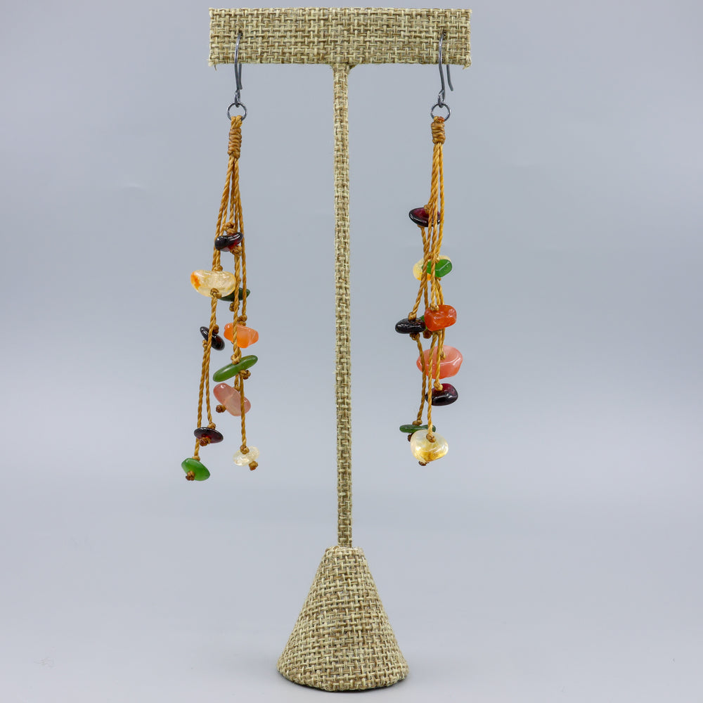 Ciela handmade gemstone dangle earrings with oxidized sterling silver ear wires on a linen hanger