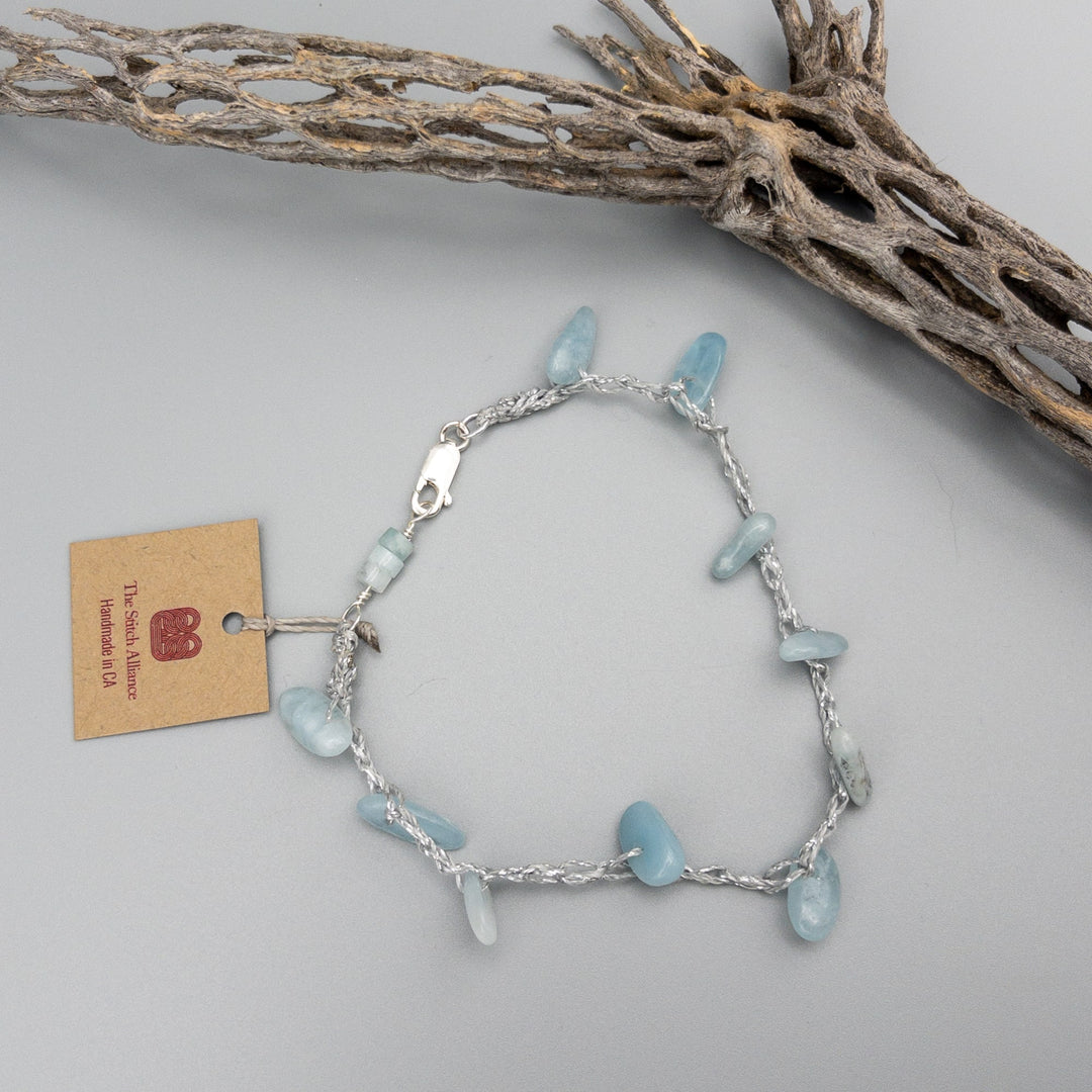 aquamarine crochet anklet with sterling silver clasp lying flat