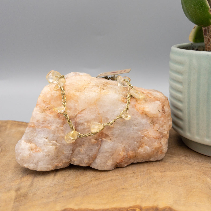 Citrine crochet anklet with gold filled clasp on a quartz rock