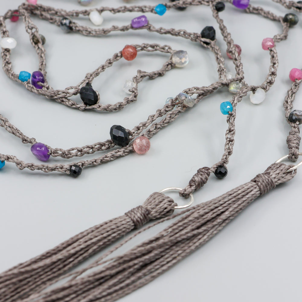 handmade crochet lariatt necklace with tourmaline, amethyst, strawberry quartz, moonstone, and labradorite gemstones