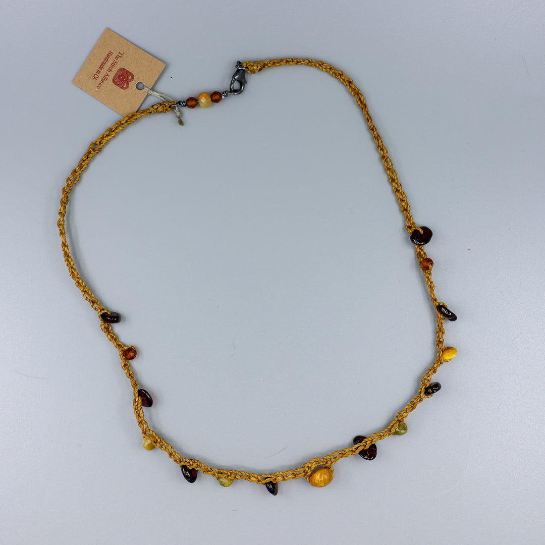 handmade crochet necklace with garnet beads and oxidized sterling silver clasp full view