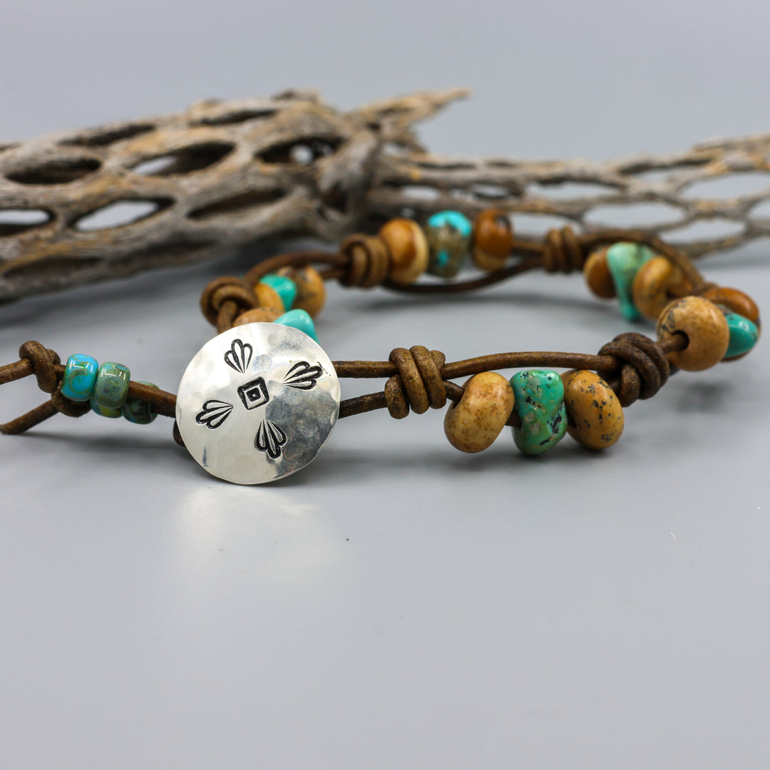 detail view handmade jasper and turquoise leather bracelet with sterling silver button clasp