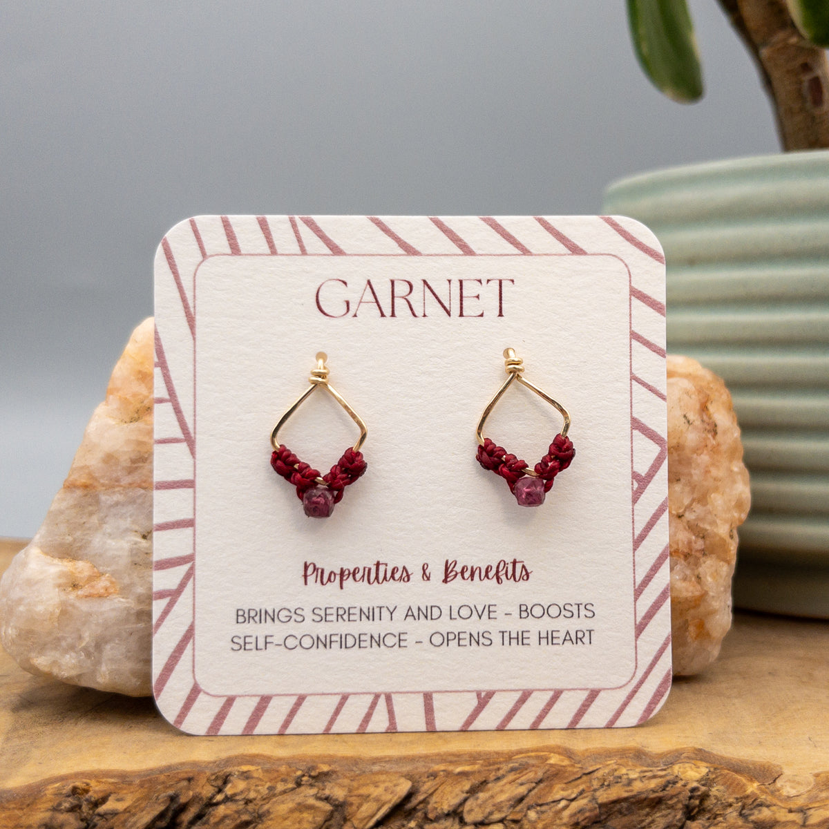 handmade garnet crystal earrings on a descriptive display card
