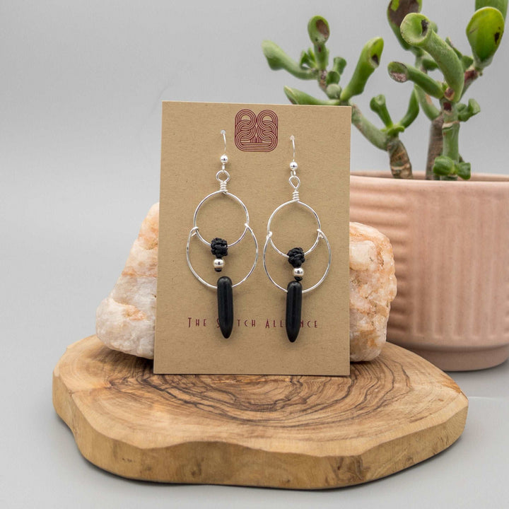 Sterling silver double hoop earrings. Handcrafted and hand-hammered with black howlite spike shaped beads.