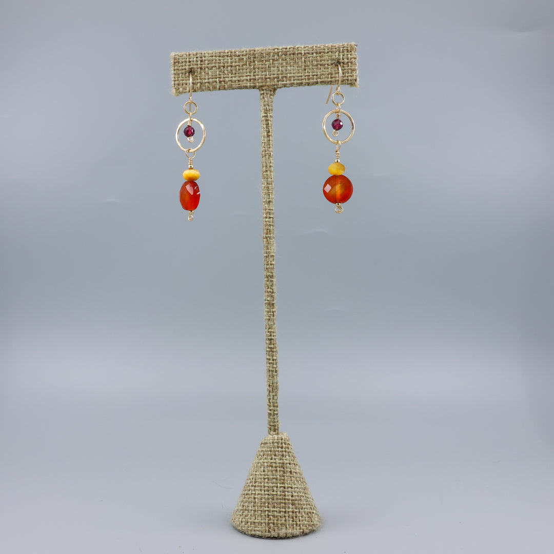 Carnelian, tiger's eye, and garnet gold filled dangle earrings on a linen hanger