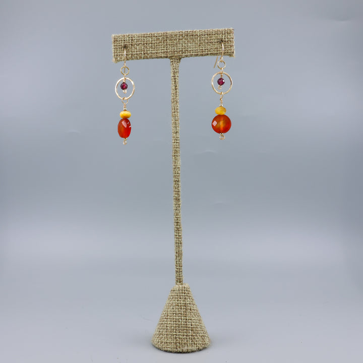 Carnelian, tiger's eye, and garnet gold filled dangle earrings on a linen hanger