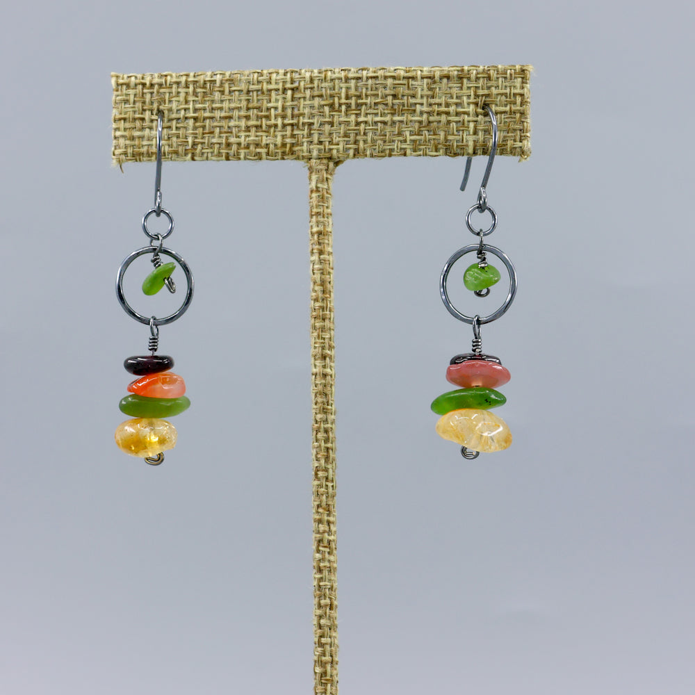 handmade fall gemstone and oxidized sterling silver earrings on a gray background