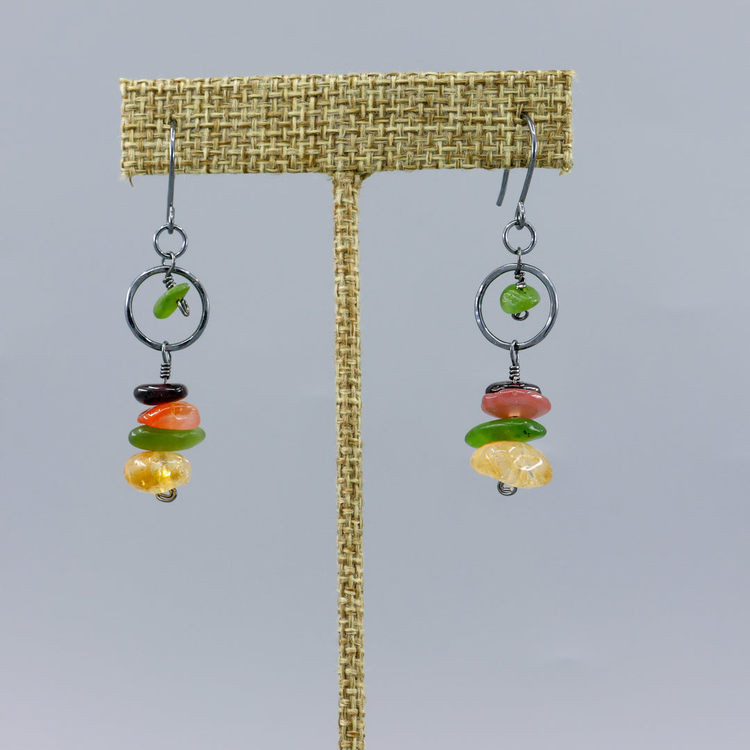 handmade fall gemstone and oxidized sterling silver earrings on a gray background