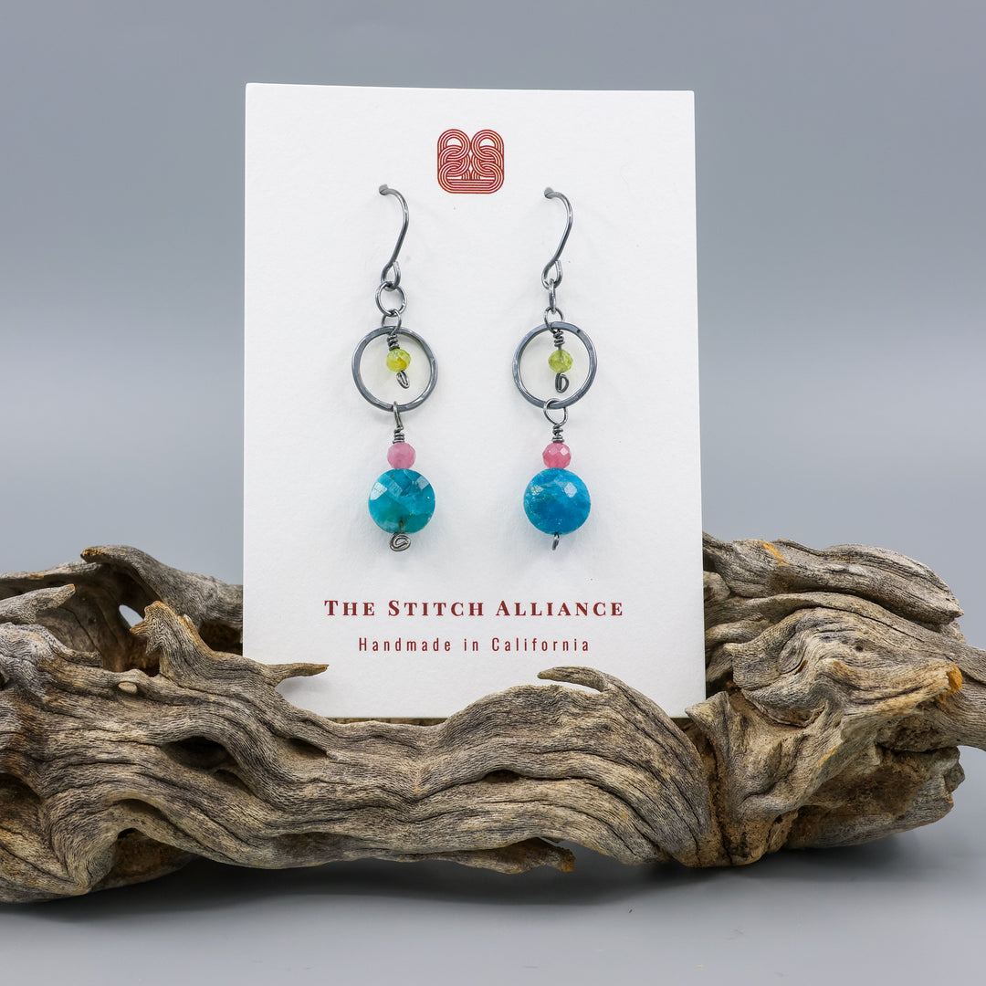 handmade gemstone and oxidized sterling silver earrings with apatite, pink tourmaline, and peridot on a white card