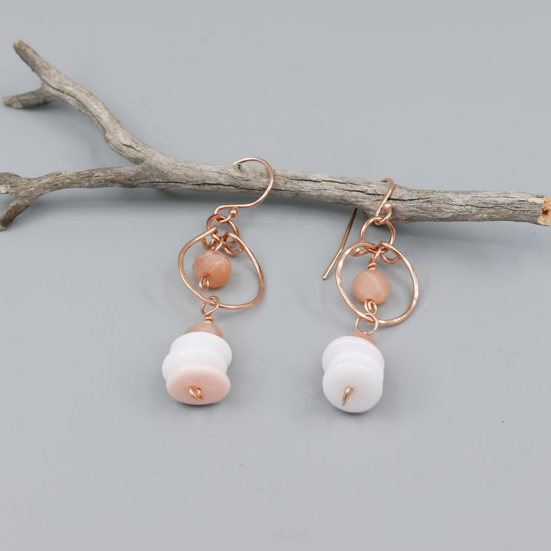 queen conch and peach moonstone rose gold dangle earrings detail