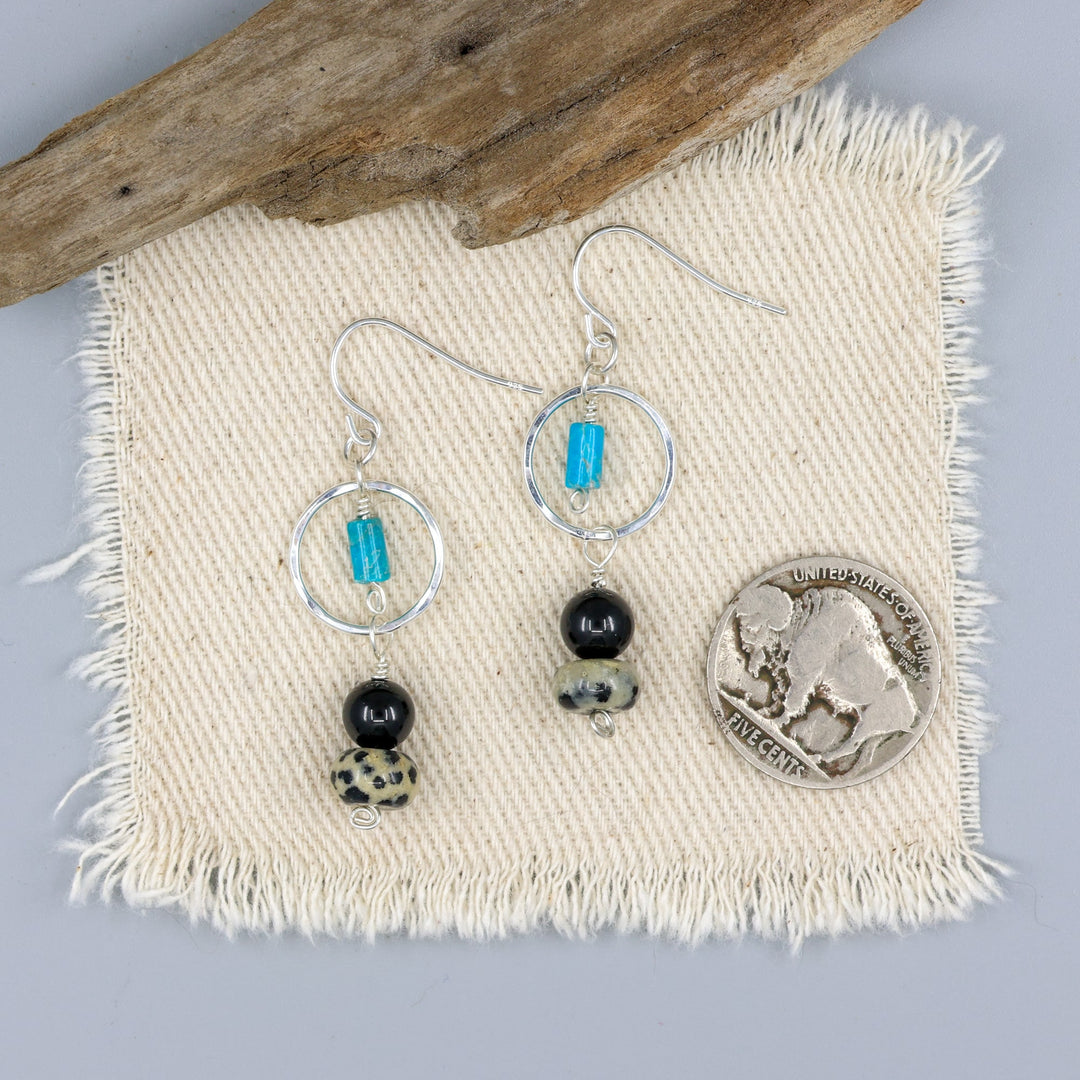 handmade dalmation jasper, spinel, and turquoise sterling silver dangel earrings with a nickel for size comparison