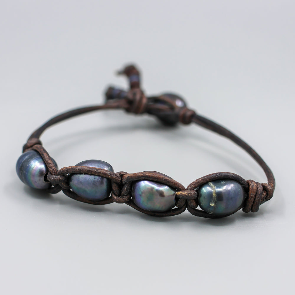 hand knotted peacock pearl and black leather bracelet