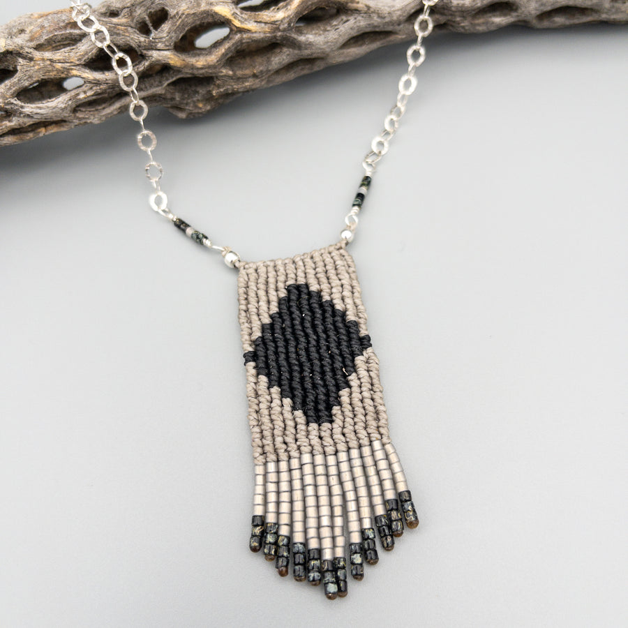 black and gray macrame necklace with seed bead fringe and sterling silver chain