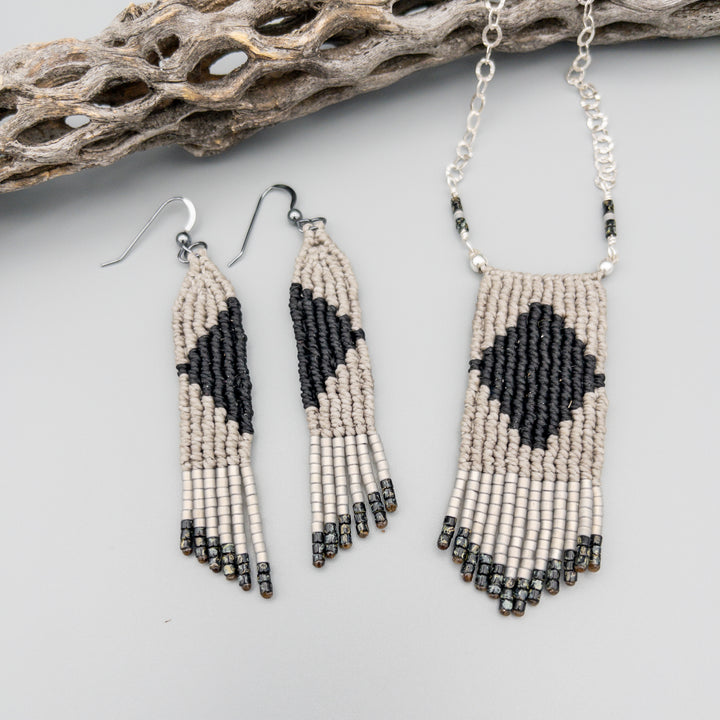 handmade macrame earrings in gray and black with oxidized sterling silver earring wires shown with necklace