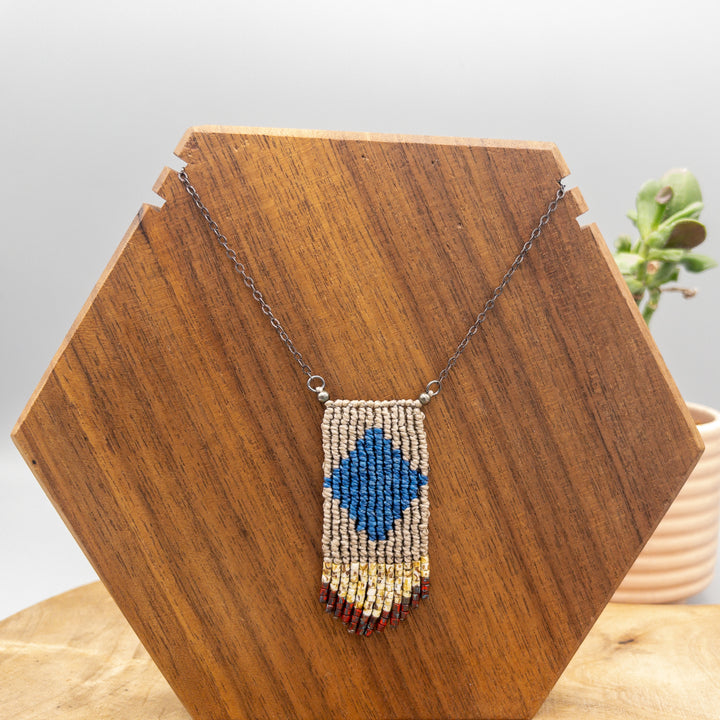 Handwoven four elements macrame necklace in blue and tan with tan and red seed bead fringe
