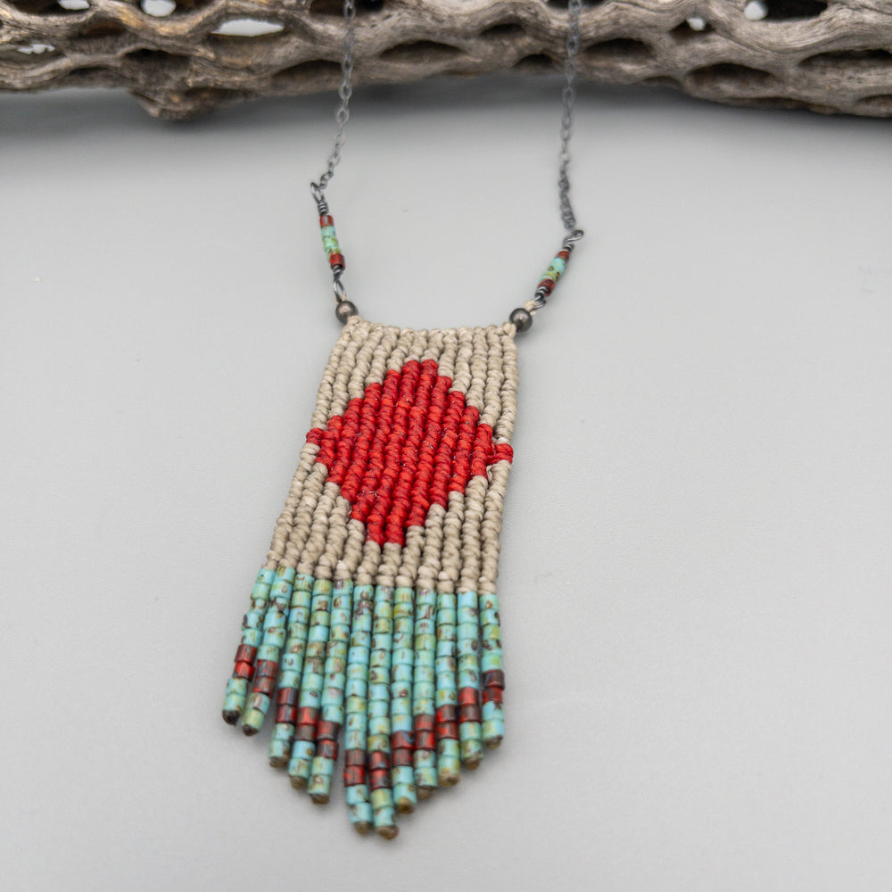 close up of red, tan, and turquoise four elements macrame necklace with seed bead fringe